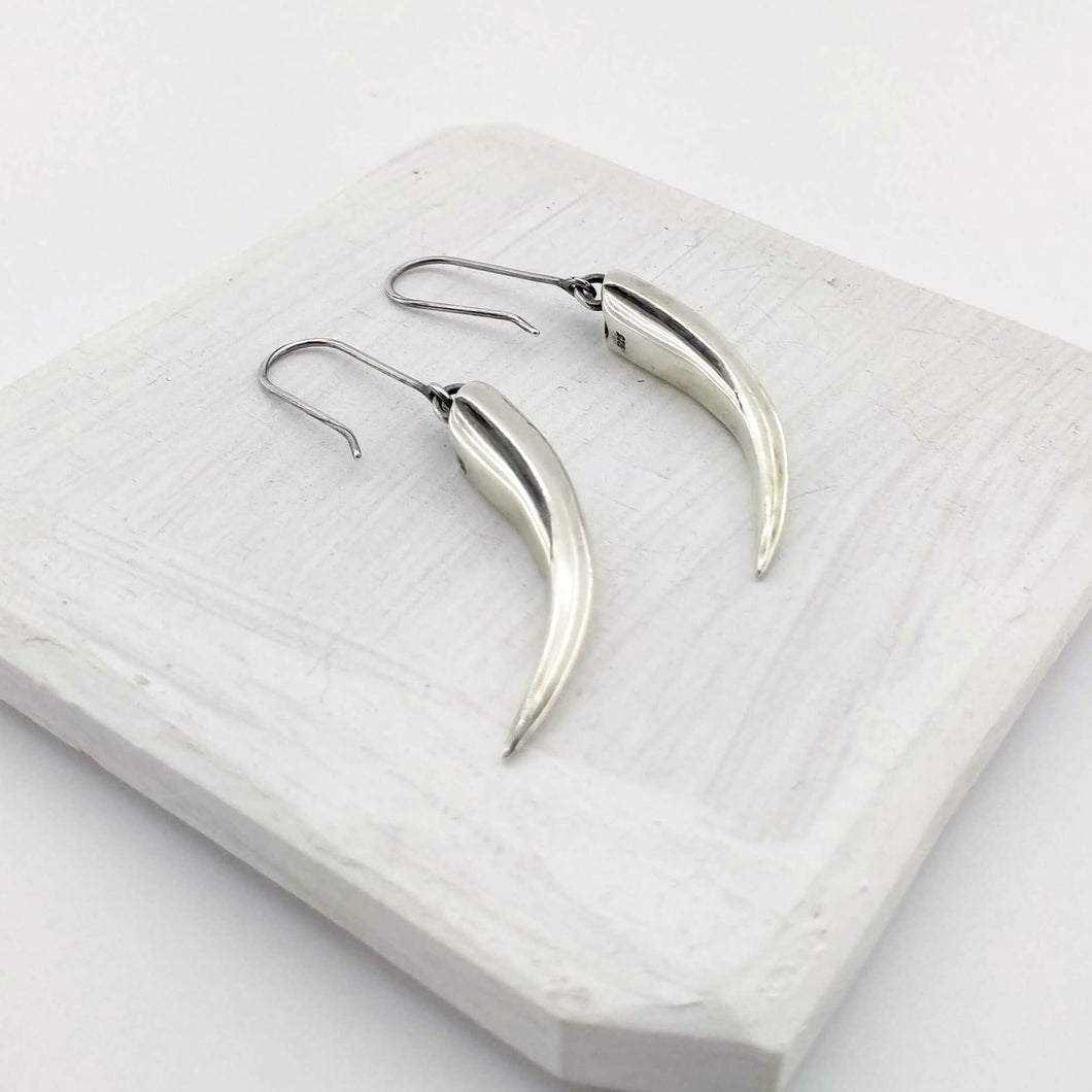 Handmade silver earrings by The Wild Jewellery NZ - the huia beak earrings in solid silver. 