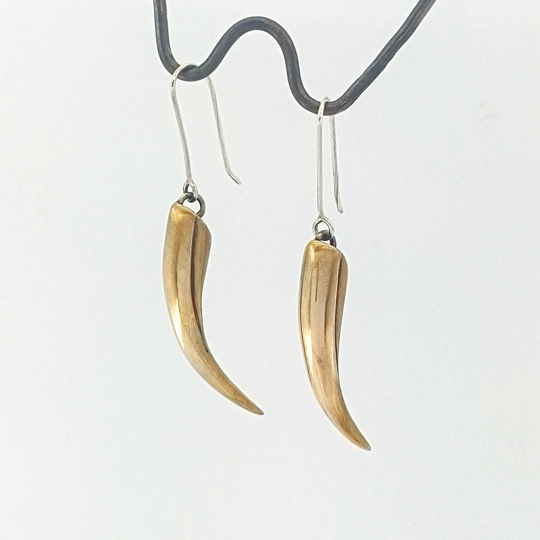 The huia beak earrings in solid bronze on sterling silver hooks. Unique NZ jewellery from The Wild.