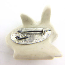 Load image into Gallery viewer, The Rabbit Brooch carved in bone with a sterling silver back. Hand crafted by NZ jeweller Vaune Mason.
